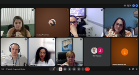 A imagem mostra a tela de uma reunião virtual, organizada em formato de grade com vários partici...